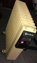 https://upload.wikimedia.org/wikipedia/commons/thumb/3/32/Electricaire_Economaster_2400_Electric_Oil_Heater.jpg/220px-Electricaire_Economaster_2400_Electric_Oil_Heater.jpg